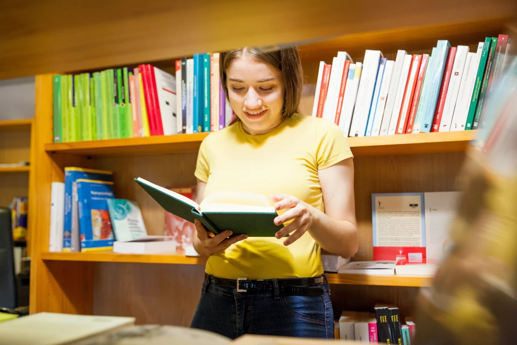 Girl smiling after finding the right book marketing company.